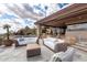 Desert home patio with a stylish seating arrangement, picturesque view, and a harmonious blend with the surrounding landscape at 6901 E Restin Rd, Carefree, AZ 85377