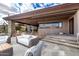 Charming patio with outdoor seating, desert plants, and rock features, offering a relaxing space to enjoy the natural Arizona landscape at 6901 E Restin Rd, Carefree, AZ 85377