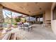 Elegant outdoor patio with stone details and landscaping, perfect for enjoying the Arizona climate and luxurious outdoor living at 6901 E Restin Rd, Carefree, AZ 85377