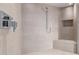 Modern shower with beautiful tile work, and a built in seat at 6901 E Restin Rd, Carefree, AZ 85377