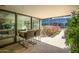 Large covered balcony with seating, views, tile flooring and landscaped flower beds at 7127 E Rancho Vista Dr # 4001, Scottsdale, AZ 85251