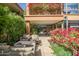 Relaxing outdoor seating area with stylish furniture and lush landscaping, perfect for entertaining guests at 7127 E Rancho Vista Dr # 4001, Scottsdale, AZ 85251