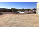 Large back yard with a decorative wall and desert landscaping at 44421 N 20Th St, New River, AZ 85087