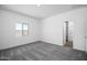 Neutral bedroom with a window, carpet flooring, and closet at 24621 W Alta Vista Rd, Buckeye, AZ 85326