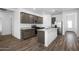 Modern kitchen featuring stainless steel appliances, granite countertops, and a stylish island at 24621 W Alta Vista Rd, Buckeye, AZ 85326