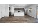 Bright and modern kitchen with a large island, granite countertops, stainless appliances, and recessed lighting at 6486 S 246Th Ln, Buckeye, AZ 85326