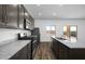 Beautiful kitchen with stainless steel appliances, granite countertops, and gray cabinets at 6486 S 246Th Ln, Buckeye, AZ 85326