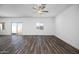 Bright living space showcasing wood-look flooring, natural light, and views of the backyard at 6486 S 246Th Ln, Buckeye, AZ 85326