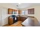 This kitchen offers wood cabinets, stainless steel appliances and laminate counters at 37108 W Bello Ln, Maricopa, AZ 85138