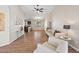 Bright and airy living room featuring hardwood floors and modern decor at 37108 W Bello Ln, Maricopa, AZ 85138