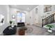 Bright living room with high ceilings, hardwood floors, and a cozy seating area at 6782 W Skylark Dr, Glendale, AZ 85308