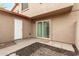 Private back patio with sliding glass door and a small landscaped area, perfect for outdoor relaxation at 4032 W Reade Ave, Phoenix, AZ 85019