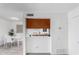 View from the kitchenette featuring modern white dining table, butcher block, and open access to the kitchen sink at 4032 W Reade Ave, Phoenix, AZ 85019