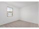 Simple bedroom with neutral walls and carpet at 40503 W Wade Dr, Maricopa, AZ 85138