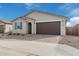 Front view of charming home with a two-car garage at 40503 W Wade Dr, Maricopa, AZ 85138