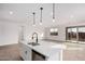 Modern kitchen island with sink and dishwasher at 40503 W Wade Dr, Maricopa, AZ 85138