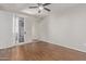 Bedroom with wood floors, ceiling fan, and patio access at 3633 N 3Rd Ave # 1089, Phoenix, AZ 85013