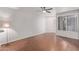Spacious living room featuring wood floors and large window at 3633 N 3Rd Ave # 1089, Phoenix, AZ 85013