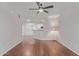 Living room with wood floors, kitchen view, and a floor lamp at 3633 N 3Rd Ave # 1089, Phoenix, AZ 85013