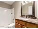 Bathroom with vanity, decorative framed mirror and shower at 5625 N 47Th Ave, Glendale, AZ 85301