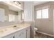 Bathroom with a sink, mirror, and toilet at 5625 N 47Th Ave, Glendale, AZ 85301