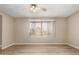 Bedroom with hardwood floors, ceiling fan and a window with coverings for filtered light at 5625 N 47Th Ave, Glendale, AZ 85301