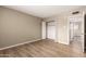 This bedroom features wood floors and an open closet at 5625 N 47Th Ave, Glendale, AZ 85301