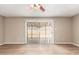 Living room with hardwood floors and sliding glass doors that lead out to the backyard at 5625 N 47Th Ave, Glendale, AZ 85301