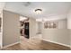 Open-concept living room featuring hardwood floors and an opening up into the kitchen at 5625 N 47Th Ave, Glendale, AZ 85301