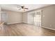 Open-concept living room with hardwood floors and sliding glass doors for great natural light at 5625 N 47Th Ave, Glendale, AZ 85301