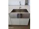 Modern farmhouse kitchen featuring a stainless steel sink and white shaker cabinets at 1973 W Brooke Ln, Queen Creek, AZ 85144