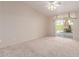 Neutral bedroom with sliding glass doors and fan at 2550 S Ellsworth Rd # 366, Mesa, AZ 85209