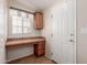 Desk area located off of kitchen with cabinet and storage drawers at 2550 S Ellsworth Rd # 366, Mesa, AZ 85209