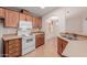 Efficient kitchen features neutral countertops, microwave, oven and tile flooring at 2550 S Ellsworth Rd # 366, Mesa, AZ 85209