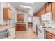 Bright kitchen features modern appliances, tile floors and adjacent desk area at 2550 S Ellsworth Rd # 366, Mesa, AZ 85209
