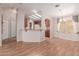 Open concept living space includes hardwood floors, breakfast bar, and adjacent kitchen at 2550 S Ellsworth Rd # 366, Mesa, AZ 85209