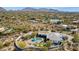 Expansive aerial view of luxury home with pool, putting green, and desert landscape with mountain views at 25583 N 89Th St, Scottsdale, AZ 85255