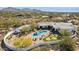 Stunning aerial view of desert home with a pool, spa, putting green, and lush landscaping at 25583 N 89Th St, Scottsdale, AZ 85255