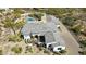 Aerial view of a custom home showcasing gray roof, desert landscaping, and outdoor patio space at 25583 N 89Th St, Scottsdale, AZ 85255