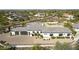 Expansive aerial view of the home showcasing its three-car garage and desert landscaping at 25583 N 89Th St, Scottsdale, AZ 85255