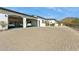 Three-car garage featuring epoxy floors and ample storage space at 25583 N 89Th St, Scottsdale, AZ 85255