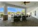 Relaxing outdoor kitchen features a grill, sink, and bar with seating for backyard gatherings at 25583 N 89Th St, Scottsdale, AZ 85255