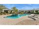 Gorgeous backyard pool with a spa and lounge chairs on a brick-paved patio at 25583 N 89Th St, Scottsdale, AZ 85255