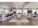 Open-concept dining room and kitchen area, perfect for entertaining with modern finishes and an elegant chandelier at 20755 W San Miguel Ave, Buckeye, AZ 85396