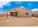 New construction home with a large backyard and covered patio at 19536 W Cambridge Ave, Buckeye, AZ 85396