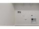 Laundry room with utility hookups and shelving at 19637 W Cartwright Ave, Buckeye, AZ 85396