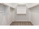 Spacious walk-in closet with double rods and shelving at 19645 W Cartwright Ave, Buckeye, AZ 85396