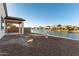 Spacious backyard with a view of a peaceful lake at 40532 W Wade Dr, Maricopa, AZ 85138