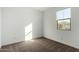 Light bedroom with carpeted floor and window at 40532 W Wade Dr, Maricopa, AZ 85138