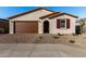 One-story house with brown garage door and red shutters at 40532 W Wade Dr, Maricopa, AZ 85138